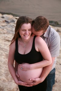 bigstockphoto_happy_dad_to_be_kissing_wife_1253793